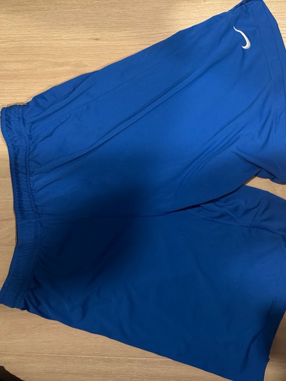 Nike Men's Blue Athletic Shorts with White Swoosh